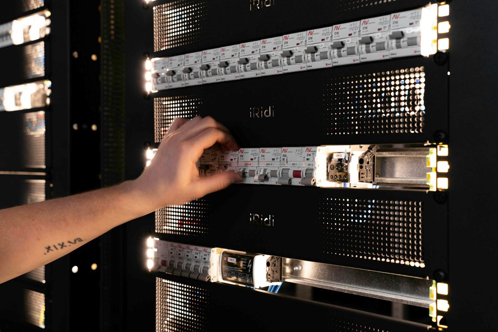 Engineer configuring equipment in a server rack